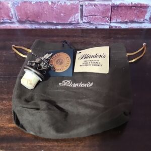 Brown Blantons Bourbon Drawstring Liquor Bag With "L" Horse Cork